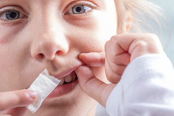 snus. tobacco in bags. a female child uses nicotine. close-up.