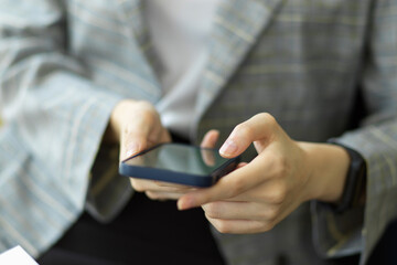 Businesswoman use smartphone for remote work, business contact