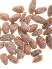 almonds with sweet sprinkles on a plate on a white background