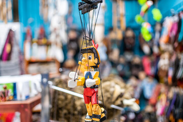 Pinocchio puppet on a toy stand in a market