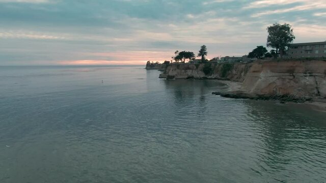 Aerial: Cliffs and calm Ocean in Capitola, Santa Cruz, USA