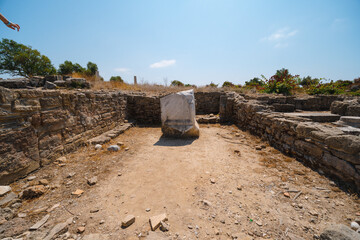 The ancient roman ruins situated in the turkish town of Side Road, stone columns, stones. Turkey