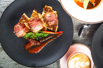 meat rolls on toast with tomato sauce top view