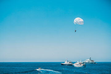 Parasailing in open sea. Water sports
