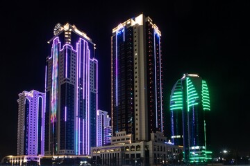 Fototapeta na wymiar Russia, the Chechen Republic, Chechnya, the city of Grozny. Night landscape. Skyscrapers of Grozny city with beautiful night illumination.