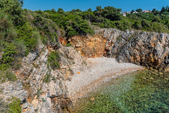 Tiny nudist beach between the rocks
