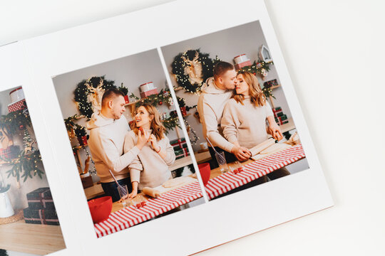 page photobook from photo shoot of couple during pregnancy in new year's kitchen