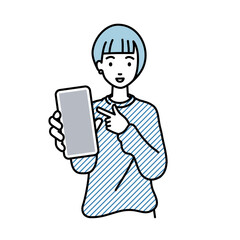 立ってスマートフォンを指差してこちらに向けて見せているリモートワークの女性