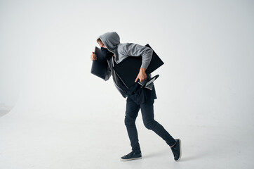 masked man stealth technique robbery safety hooligan light background