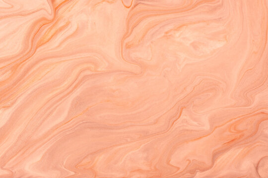 Abstract fluid art background light coral colors. Liquid marble. Acrylic painting with peach gradient and splash.