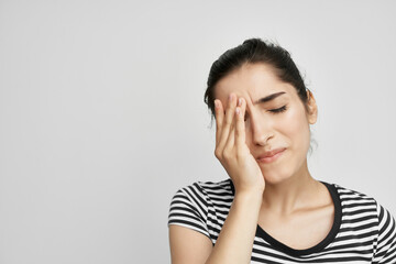 Fototapeta premium woman holding his head migraine depression light background
