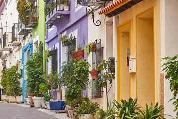 Fototapeta na wymiar Picturesque colored facades in Calpe old town. Mediterranean coast. Alicante