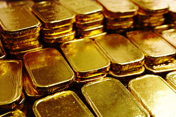 Group of gold bars array on the table , investment concept .