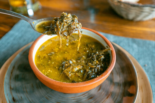Traditional Armenian herbal soup with aveluk or horse sorrel. The concept of folk cuisine and healthy vegetarian dishes