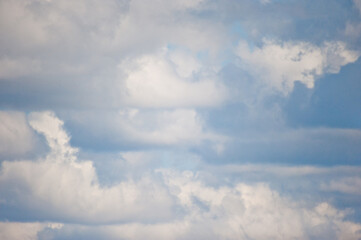 Beautiful gentle blue sky with white fluffy clouds.