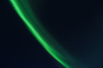 northern lights against the background of the starry sky. aurora borealis in winter night