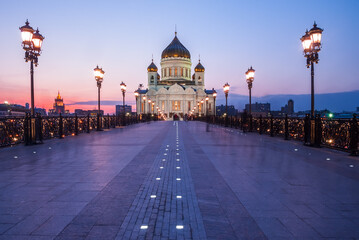 Fototapeta na wymiar Cathedral of Christ the Savior with beautiful illumination in the light of evening city lighting. Cityscape at sunset.