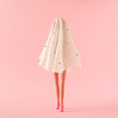 Girl in ghost costume with pink high heels. Minimal fashion halloween costume party concept.