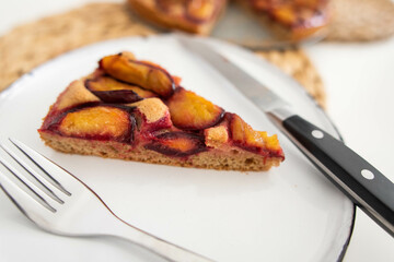 a piece of delicious plum pie