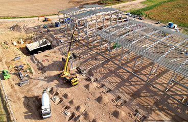 Warehouse Construction from metal structure. Industrial building on light gauge steel framing....