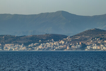 Saranda, Albania, seen from far away in Adriatic Sea, spring day sailing
