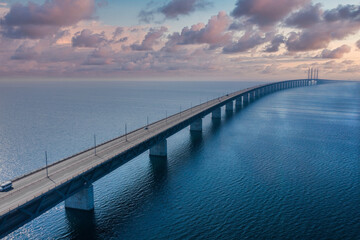 Fototapeta na wymiar Panoramic aerial view of the Oresundsbron bridge between Denmark and Sweden. Oresund Bridge view at sunset.