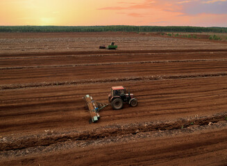 Peat Harvester Tractor on Collecting Extracting Peat. Mining and harvesting peatland. Area drained...