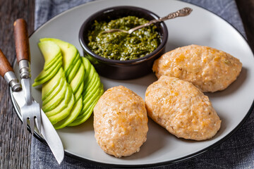 Baked white fish cakes with avocado and sauce