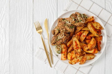 Grilled Pork Shoulder Steaks with potato wedges