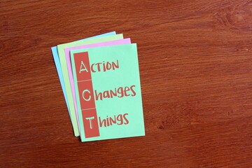 Color notepaper with text ACT Action Changes Things