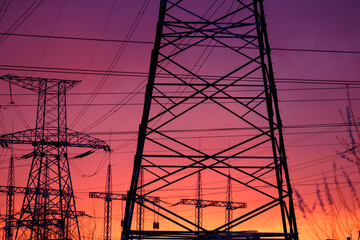 Transmission line, natural energy. electric pillars on sunset. high voltage post.High-voltage tower...