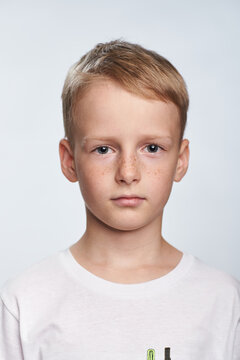 Boy blond 10 years old photo for document on white background