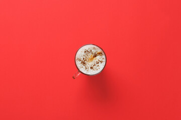 Cup of coffee on red background
