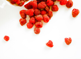 raspberries on a white