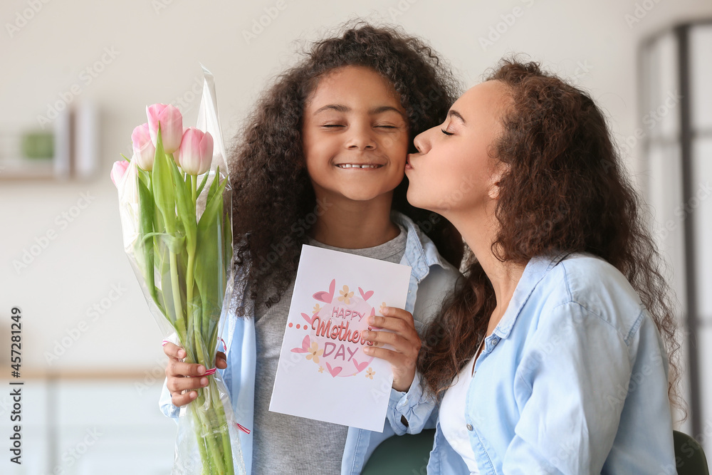 Canvas Prints african-american little girl greeting her mother at home