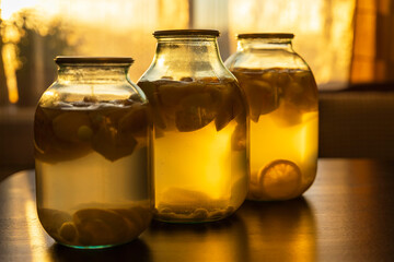 apple compote in glass jars on the kitchen table, soft evening light