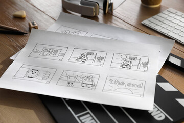 Storyboards with cartoon sketches at workplace, closeup. Pre-production process