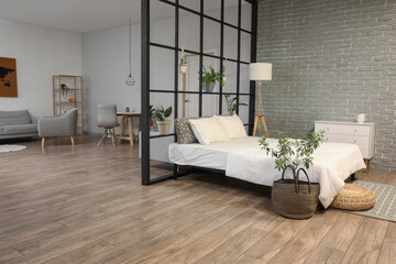 Interior of stylish bedroom with folding screen