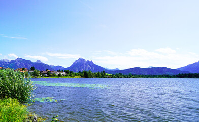 View of the Hopfensee and the surrounding mountains near Füssen. Landscape in Bavaria.