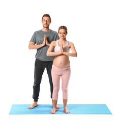 Obraz premium Young pregnant woman and her husband practicing yoga on white background