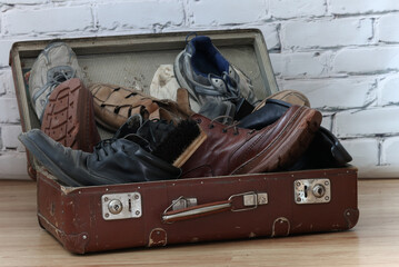 old suitcase and old vintaje men's shoues.