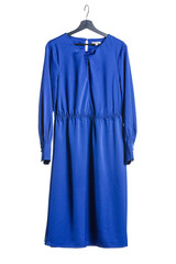 Hanger with stylish female dress on white background