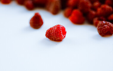 raspberries on a white background