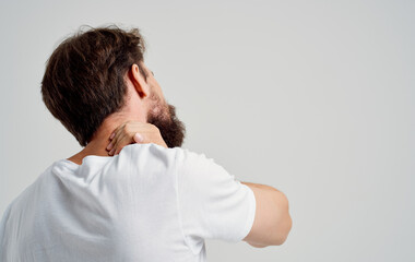 emotional man pain in the neck health problems massage therapy light background