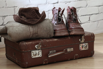 Vintaje suitcase and winter vintage mens clothing and shoes.