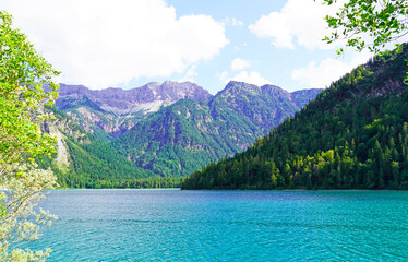 Landscape at the Plansee in Tyrol, Austria. Turquoise colored lake with surrounding landscape and mountains.