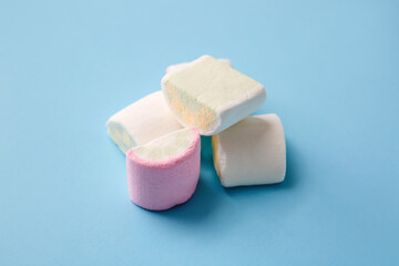 Tasty marshmallows on color background