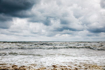 Storm clouds over the sea. Dramatic sky and giant waves