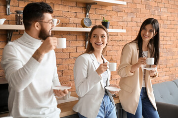 People having coffee break in office