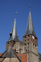 Fototapeta na wymiar The Saint Nicholas Church in Deventer, the Netherlands, against a blue sky
